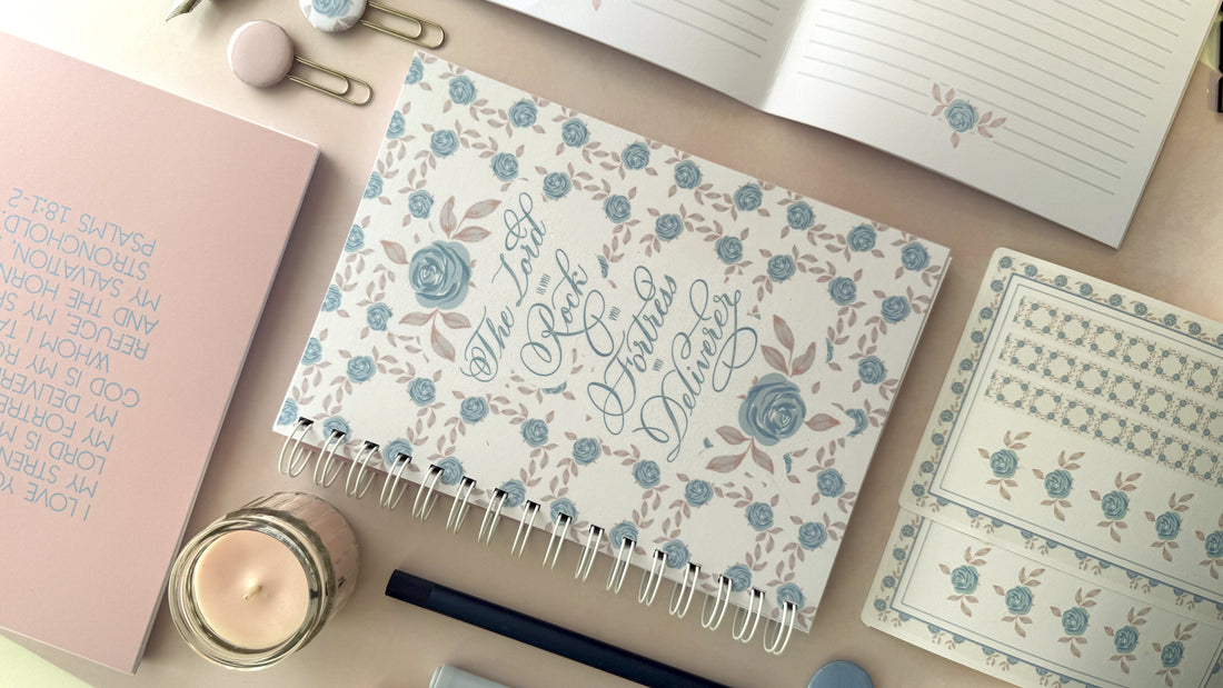 Wirebound Prayer Journal with blue floral design featuring an excerpt Psalm 18 on the cover