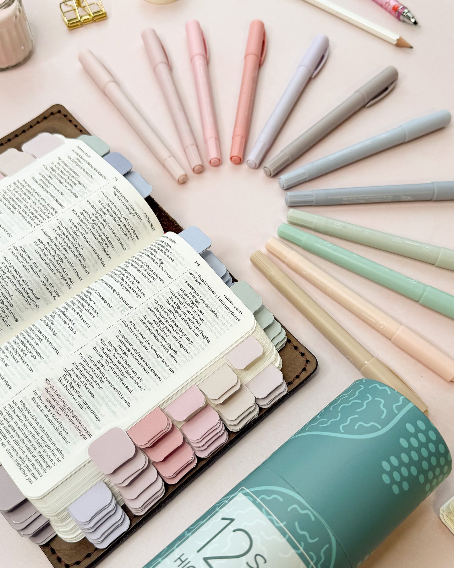 Pastel highlighters shown next to a Bible marked with matching pastel mini tabs