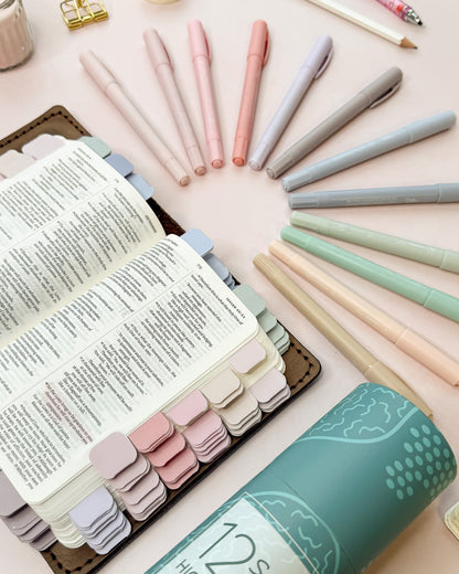 Pastel highlighters shown next to a Bible marked with matching pastel mini tabs