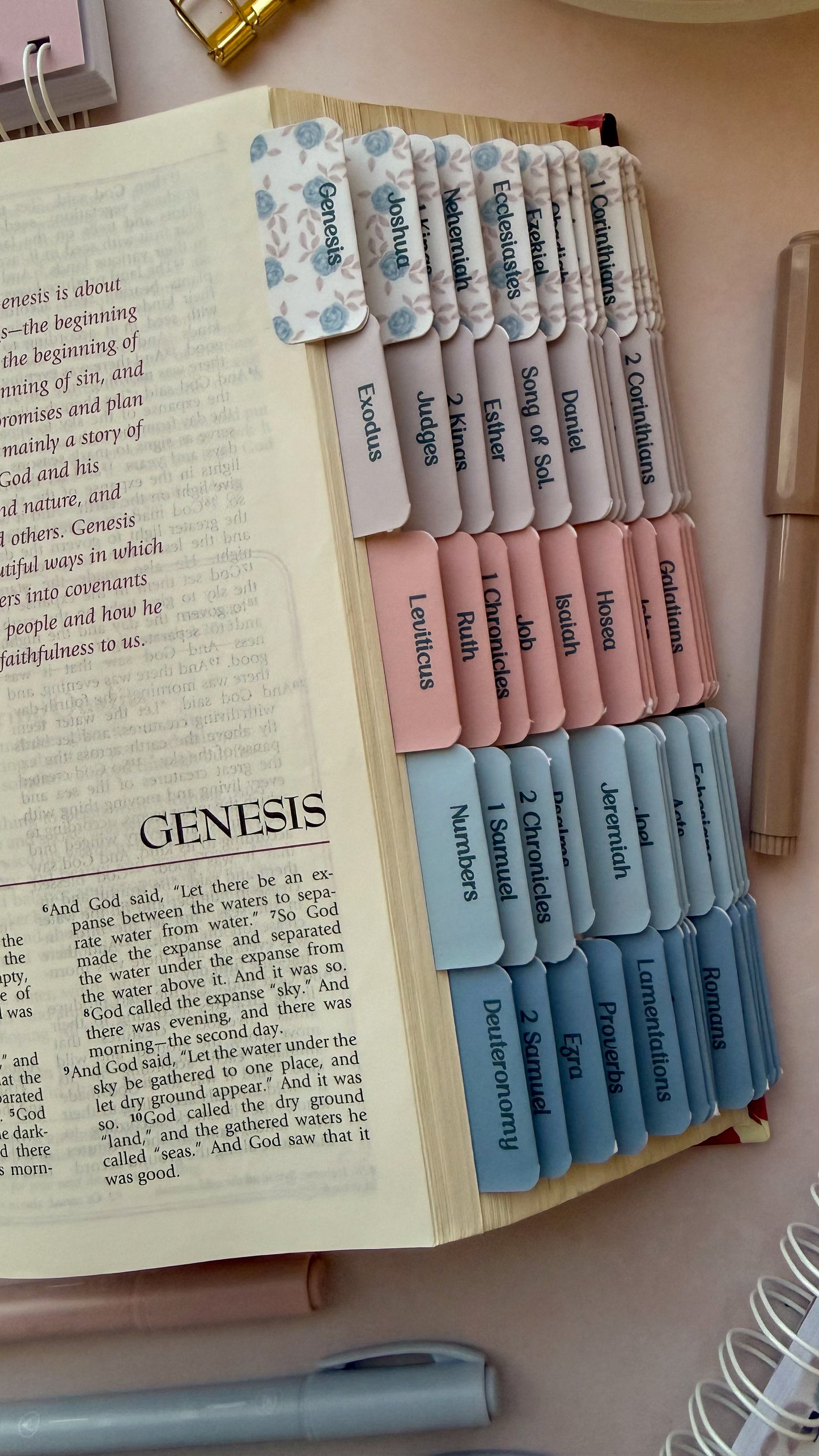Open bible with DotK Design Bible Tabs in shades of pink and blue with a floral design inspired by Psalm 18