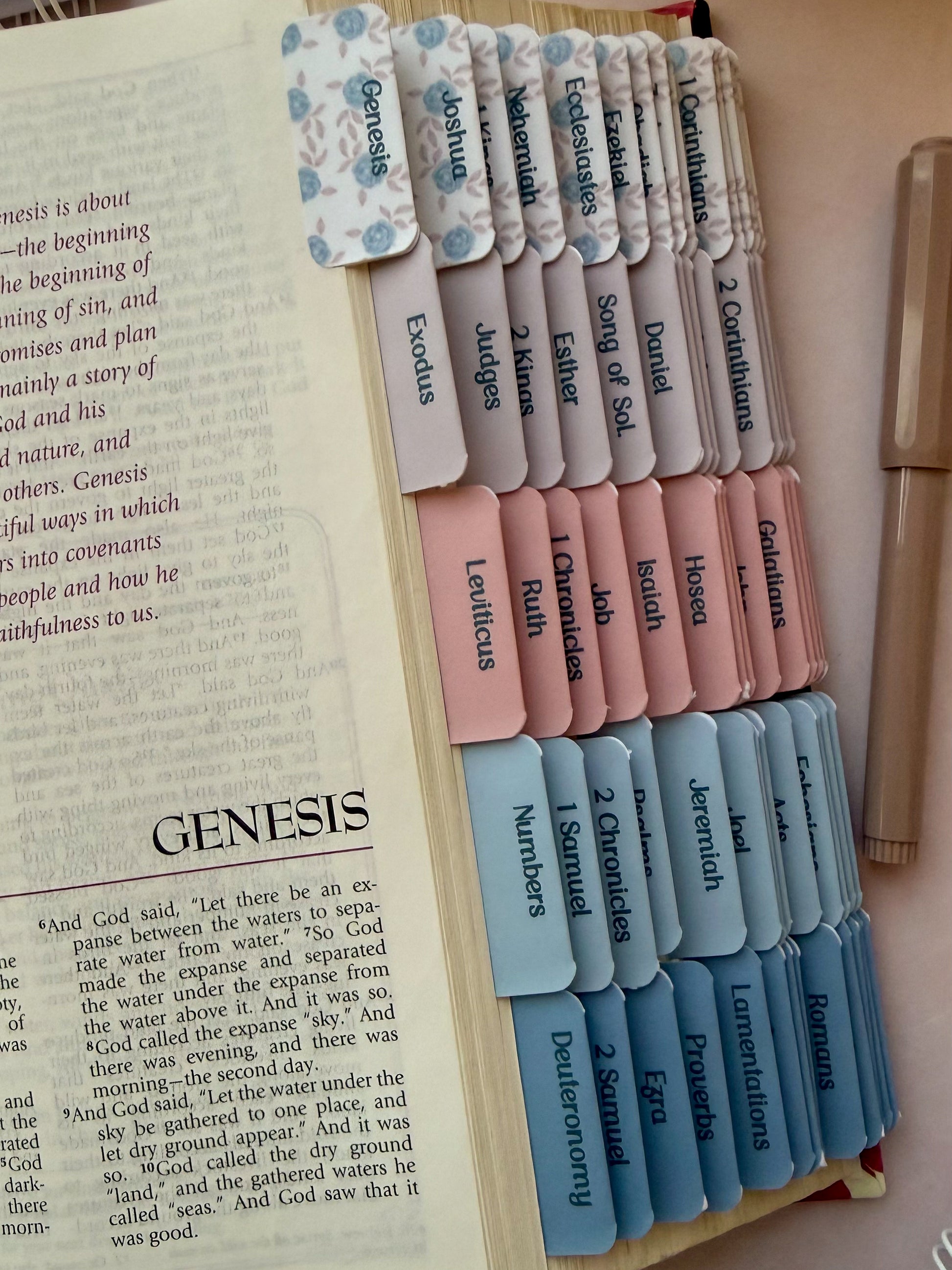 Open bible with DotK Design Bible Tabs in shades of pink and blue with a floral design inspired by Psalm 18