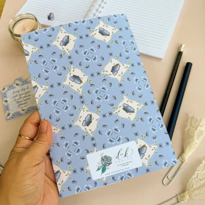 DotK a5 Journal featuing a blue butterfly design