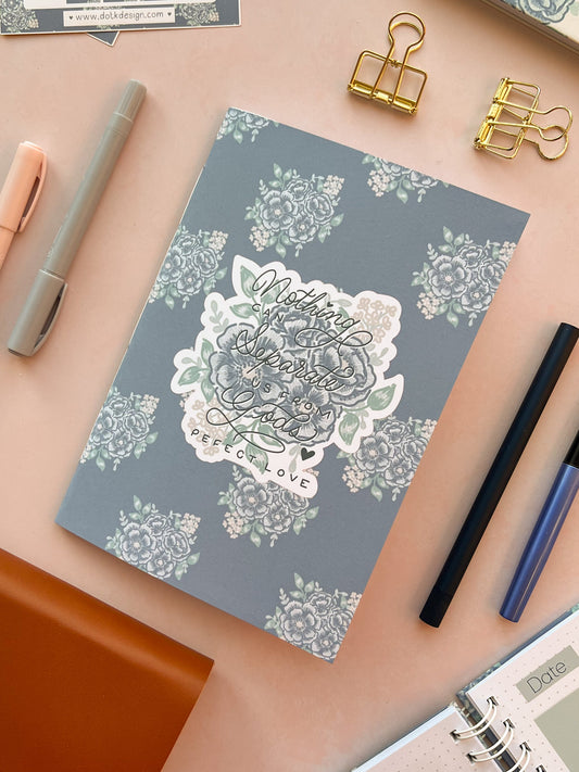 Blue Christian prayer journal notebook featuring a blue floral design & Hand-lettering inspired by Romans 8:38-39 on the cover