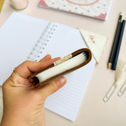 Pocket Bible with brown leather cover and woven floral trim