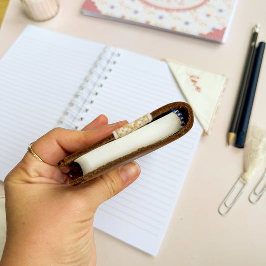 Pocket Bible with brown leather cover and woven floral trim