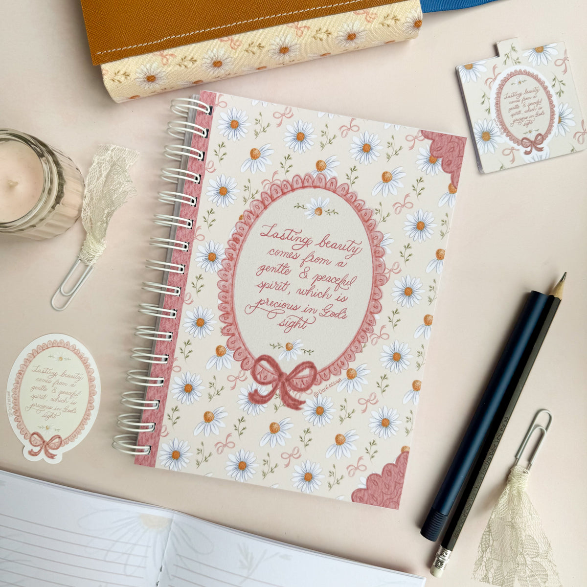 Wirebound notebook with daisies and bows, with a hand lettered excerpt from 1 Peter 3:3-4