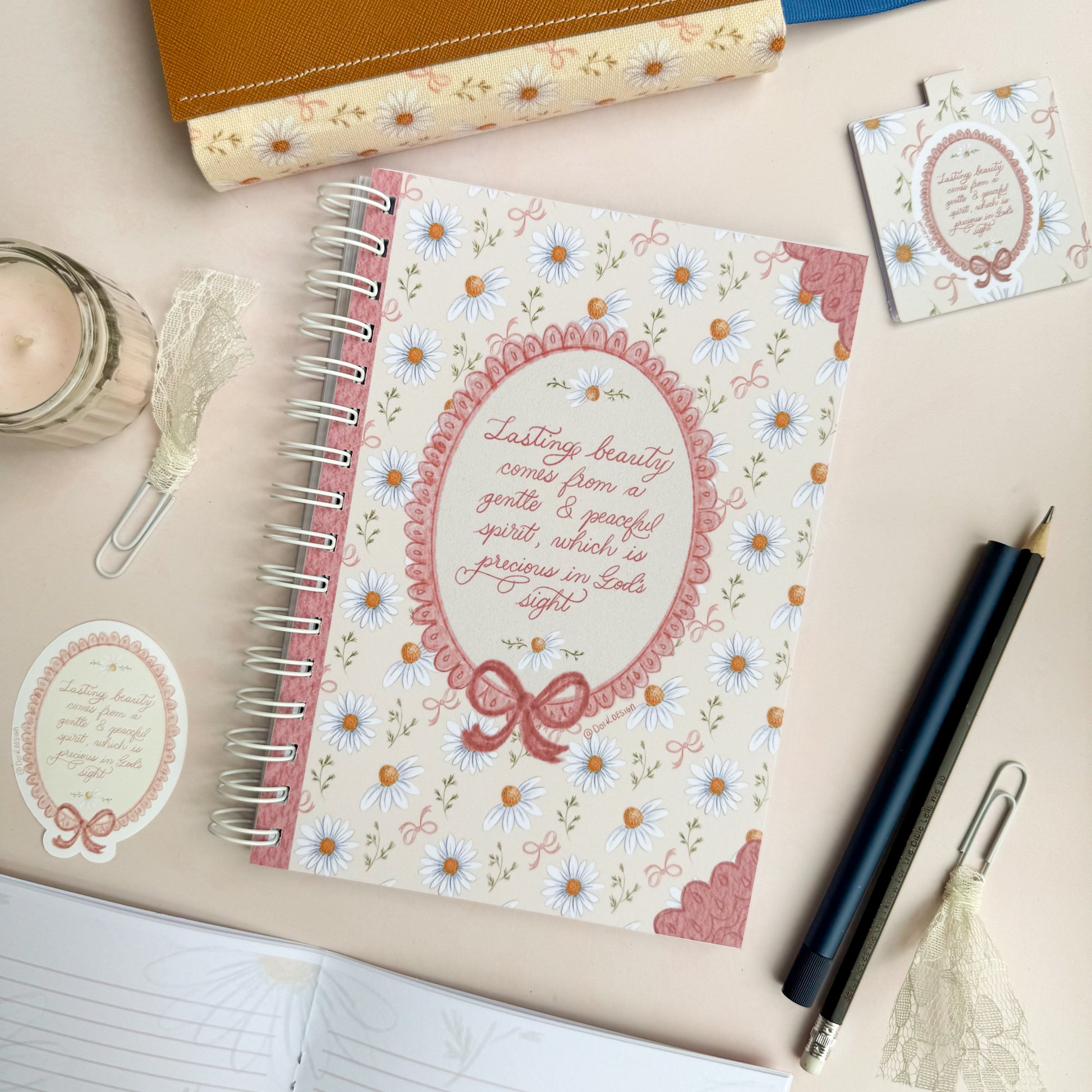 Wirebound notebook with daisies and bows, with a hand lettered excerpt from 1 Peter 3:3-4