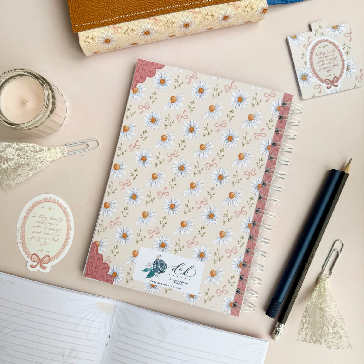 Wirebound notebook with daisies and bows, with a hand lettered excerpt from 1 Peter 3:3-4